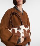 Miu Miu Beau Medium calf hair shoulder bag in white cow print with gold hardware
