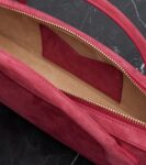 Alaïa Le Teckel Small Suede Clutch Bag in Framboise Pink
